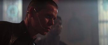 Movie still from “Die Hard 2” (1990), directed by Renny Harlin – A person wearing a headset; Close Up shot, Low angle