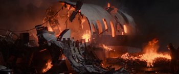 Movie still from “Die Hard 2” (1990), directed by Renny Harlin – A fire is burning in the middle of a building; Extreme Wide shot, Low angle