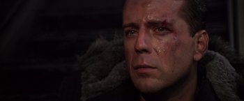 Movie still from “Die Hard 2” (1990), directed by Renny Harlin – A person with a scar on his face; Close Up shot, Low angle