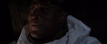 Movie still from “Die Hard 2” (1990), directed by Renny Harlin – A man's face in the dark; Close Up shot, High angle