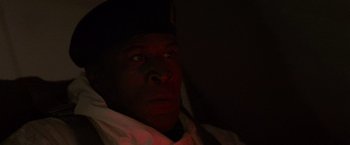 Movie still from “Die Hard 2” (1990), directed by Renny Harlin – A person wearing a hat; Close Up shot, Low angle