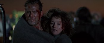 Movie still from “Die Hard 2” (1990), directed by Renny Harlin – A man and a woman covered in blood; Close Up shot, Low angle