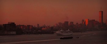 Movie still from “Die Hard with a Vengeance” (1995), directed by John McTiernan – A large cruise ship in a body of water; Extreme Wide shot, High angle