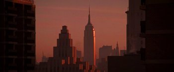 Movie still from “Die Hard with a Vengeance” (1995), directed by John McTiernan – A view of the empire state building at sunset; Extreme Wide shot, Low angle