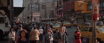 Movie still from “Die Hard with a Vengeance” (1995), directed by John McTiernan – A crowd of people walking down a busy street; Extreme Wide shot, High angle