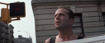 Movie still from “Die Hard with a Vengeance” (1995), directed by John McTiernan – A person looking up at the sky; Close Up shot, Low angle