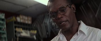 Movie still from “Die Hard with a Vengeance” (1995), directed by John McTiernan – A person wearing a headset; Close Up shot, Low angle