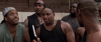 Movie still from “Die Hard with a Vengeance” (1995), directed by John McTiernan – A group of men standing next to each other; Close Up shot, Low angle