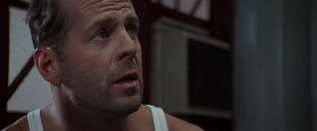 Movie still from “Die Hard with a Vengeance” (1995), directed by John McTiernan – A man's face looking up; Close Up shot, Low angle