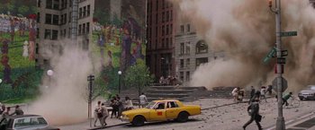 Movie still from “Die Hard with a Vengeance” (1995), directed by John McTiernan – A yellow taxi cab parked on the side of the street; Extreme Wide shot, High angle