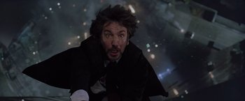 Movie still from “Die Hard with a Vengeance” (1995), directed by John McTiernan – A man in a black jacket is looking at the camera; Close Up shot, Low angle