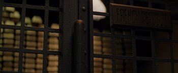 Movie still from “Die Hard with a Vengeance” (1995), directed by John McTiernan – A fence with a sign on it's side; Extreme Close Up shot, High angle