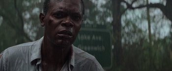 Movie still from “Die Hard with a Vengeance” (1995), directed by John McTiernan – A person wearing a white shirt; Close Up shot, Low angle