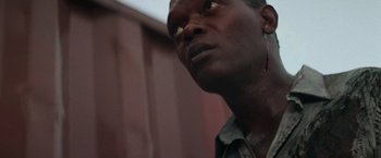 Movie still from “Die Hard with a Vengeance” (1995), directed by John McTiernan – A person looking up at the sky; Close Up shot, Low angle