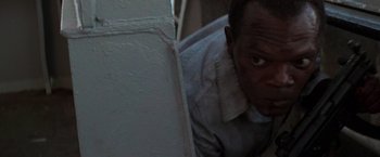 Movie still from “Die Hard with a Vengeance” (1995), directed by John McTiernan – A person leaning against a wall; Close Up shot, High angle