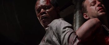 Movie still from “Die Hard with a Vengeance” (1995), directed by John McTiernan – A person with blood on his face; Close Up shot, Low angle