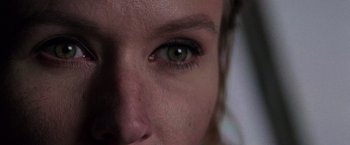 Movie still from “Die Hard with a Vengeance” (1995), directed by John McTiernan – A woman's eye with green eyes; Extreme Close Up shot, Overhead angle
