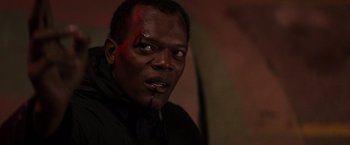 Movie still from “Die Hard with a Vengeance” (1995), directed by John McTiernan – A person with blood on his face; Close Up shot, Over the shoulder angle