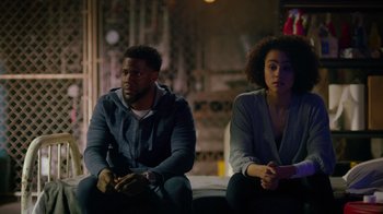 Movie still from “Die Hart” (2023), directed by Eric Appel – A man and a woman sitting next to each other; Medium shot, Over the shoulder angle