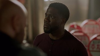 Movie still from “Die Hart” (2023), directed by Eric Appel – A person looking at something; Close Up shot, Over the shoulder angle