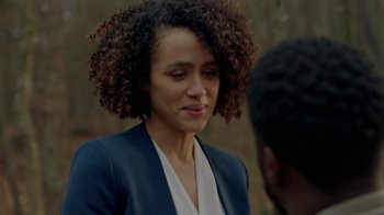 Movie still from “Die Hart” (2023), directed by Eric Appel – A person wearing a suit; Close Up shot, Over the shoulder angle