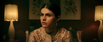 Movie still from “Die in a Gunfight” (2021), directed by Collin Schiffli – A woman in a brown jacket looking to her left; Close Up shot, Low angle