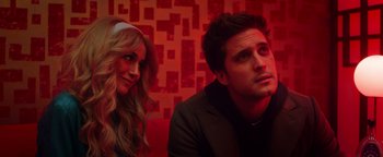 Movie still from “Die in a Gunfight” (2021), directed by Collin Schiffli – A man and a woman sitting next to each other; Close Up shot, Over the shoulder angle