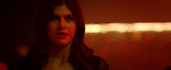 Movie still from “Die in a Gunfight” (2021), directed by Collin Schiffli – A beautiful woman with long red hair and green eyes; Close Up shot, Low angle