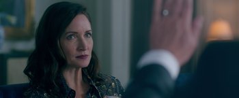 Movie still from “Die in a Gunfight” (2021), directed by Collin Schiffli – A person sitting in front of another person; Close Up shot, Over the shoulder angle