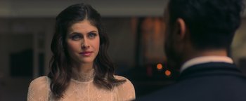 Movie still from “Die in a Gunfight” (2021), directed by Collin Schiffli – A beautiful young lady wearing a white dress; Close Up shot, Over the shoulder angle