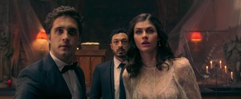 Movie still from “Die in a Gunfight” (2021), directed by Collin Schiffli – A group of people standing next to each other in a room; Medium shot, Low angle