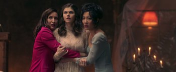 Movie still from “Die in a Gunfight” (2021), directed by Collin Schiffli – A group of women standing next to each other in a room; Medium shot, High angle