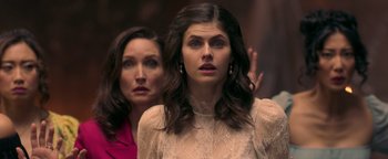 Movie still from “Die in a Gunfight” (2021), directed by Collin Schiffli – Two women standing next to each other in front of a wall; Close Up shot, Over the shoulder angle