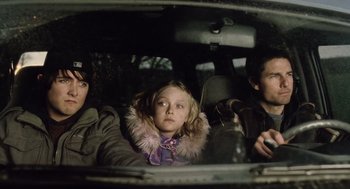 Movie still from “War of the Worlds” (2005), directed by Steven Spielberg – Three people in a car looking out the window; Medium shot, Over the shoulder angle