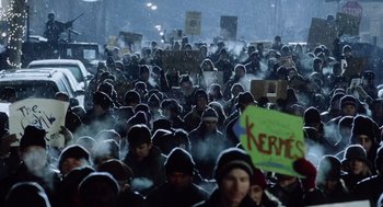 Movie still from “War of the Worlds” (2005), directed by Steven Spielberg – A large group of people are gathered together in the snow; Wide shot, High angle