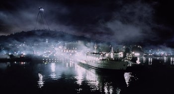 Movie still from “War of the Worlds” (2005), directed by Steven Spielberg – A large boat in a body of water at night; Extreme Wide shot, Low angle