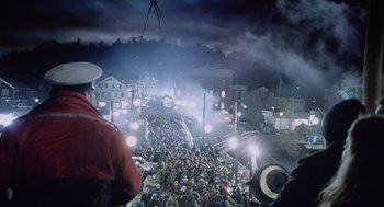 Movie still from “War of the Worlds” (2005), directed by Steven Spielberg – A crowd of people walking down a street; Extreme Wide shot, High angle