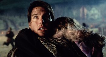 Movie still from “War of the Worlds” (2005), directed by Steven Spielberg – A man and a woman are holding each other in the dark; Close Up shot, Low angle