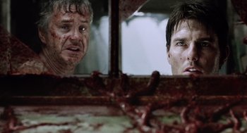 Movie still from “War of the Worlds” (2005), directed by Steven Spielberg – Two men looking at each other in a mirror; Close Up shot, Low angle