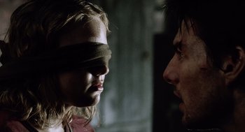 Movie still from “War of the Worlds” (2005), directed by Steven Spielberg – A man and a woman face each other blindfolded; Close Up shot, Over the shoulder angle