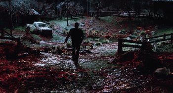Movie still from “War of the Worlds” (2005), directed by Steven Spielberg – A man walking through a field covered in blood; Extreme Wide shot, High angle