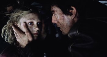 Movie still from “War of the Worlds” (2005), directed by Steven Spielberg – A man and a woman looking into each other's eyes in the dark; Close Up shot, Over the shoulder angle