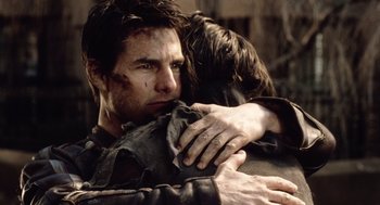 Movie still from “War of the Worlds” (2005), directed by Steven Spielberg – A man hugging another man with his hands on his chest; Close Up shot, Over the shoulder angle