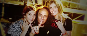 A man and two women posing for a picture