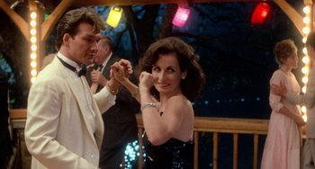 Movie still from “Dirty Dancing” (1987), directed by Emile Ardolino – A man and a woman are dancing together; Medium shot, Over the shoulder angle