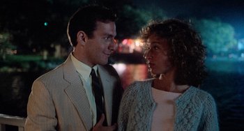 Movie still from “Dirty Dancing” (1987), directed by Emile Ardolino – A man and a woman standing next to each other; Medium shot, Over the shoulder angle