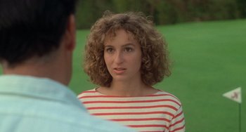 Movie still from “Dirty Dancing” (1987), directed by Emile Ardolino – A woman in a striped shirt talking to a man in a striped shirt; Close Up shot, Over the shoulder angle