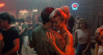 Movie still from “Dirty Dancing” (1987), directed by Emile Ardolino – A man and a woman are dancing in a club; Medium shot, Low angle