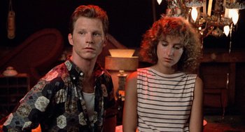 Movie still from “Dirty Dancing” (1987), directed by Emile Ardolino – A man and a woman standing next to each other; Close Up shot, Over the shoulder angle