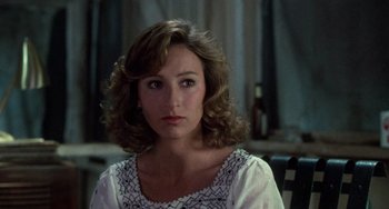 Movie still from “Dirty Dancing” (1987), directed by Emile Ardolino – A person with curly hair wearing a white shirt; Close Up shot, Over the shoulder angle